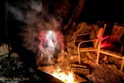 Musher Lance Mackey warms his hands over the fire at Steppingstone. He confessed that without working hands ‘it was all over’. He then explained the condition of his own. Not so good. I then explained that as a photographer I faced the same problem, and same condition, for the same reasons.
