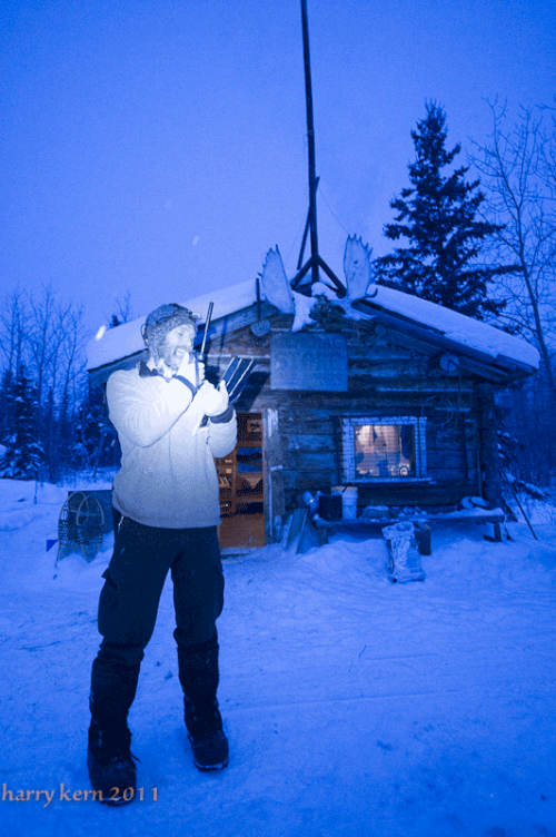 Sebastian Jones uses a satellite phone to post in/out times back to Quest headquarters.